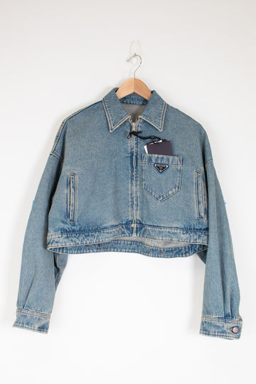 Denim jacket with a brand logo on a white background