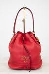 Red Prada handbag on a white background