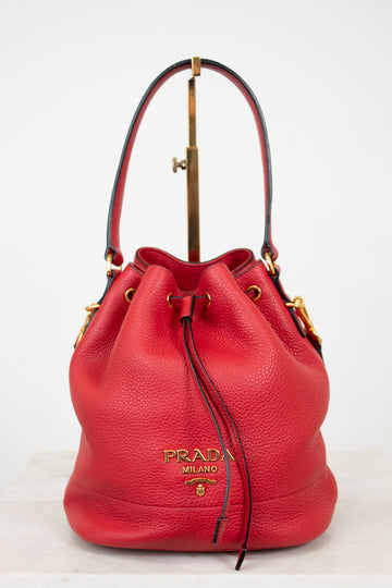 Red Prada handbag on a white background