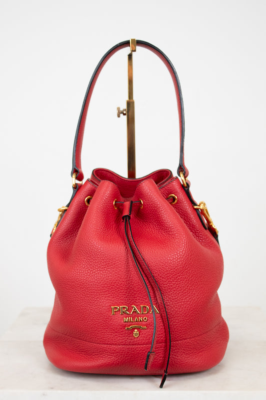 Red Prada handbag on a white background