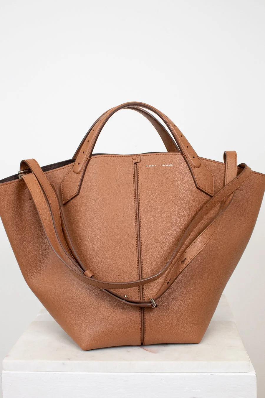 Brown leather handbag on a white background