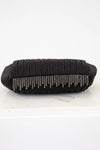 Black clutch bag with silver fringe on a white background