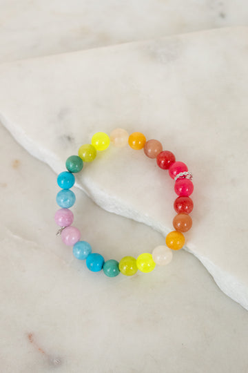 Colorful beaded bracelet on a marble surface