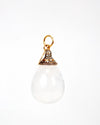 White teardrop-shaped pendant with gold and diamond accents on a white background