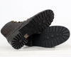 Metallic boots with textured sole on a white background