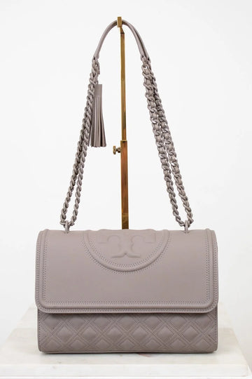 Gray handbag with chain strap on a white background