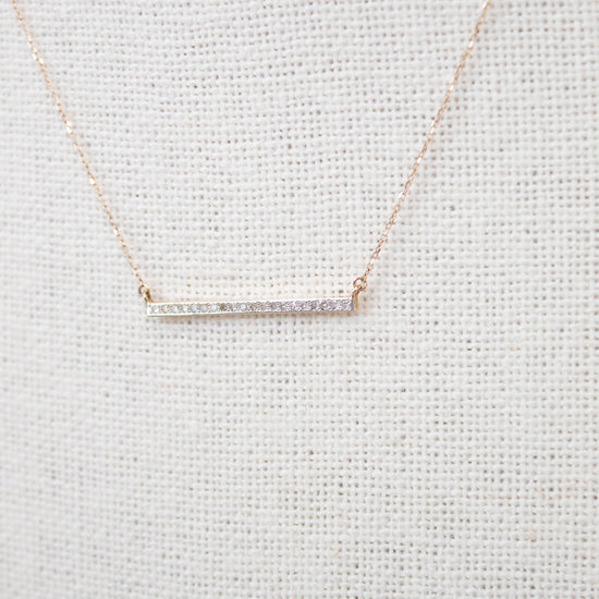Dainty gold chain with diamond bar detail
