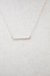 Dainty gold chain with diamond bar detail