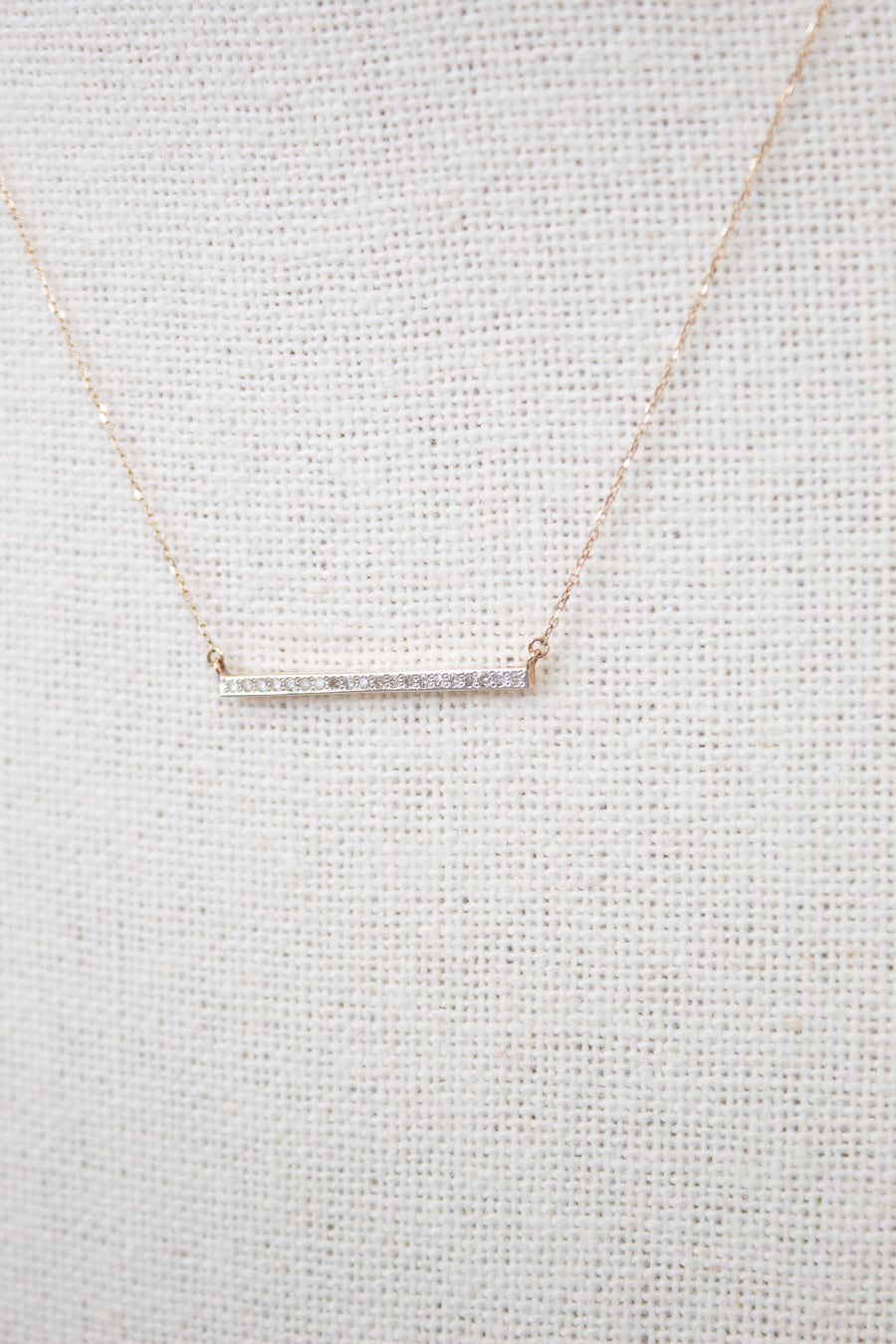 Dainty gold chain with diamond bar detail