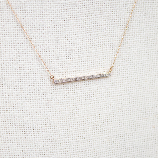 Dainty gold chain with diamond bar detail