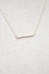 Dainty gold chain with diamond bar detail