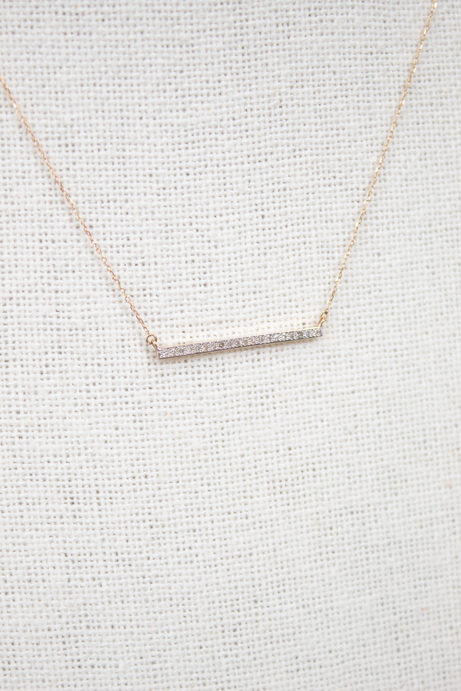 Dainty gold chain with diamond bar detail