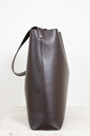 Brown leather tote bag on a white background