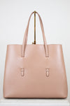 Beige leather tote purse on white background