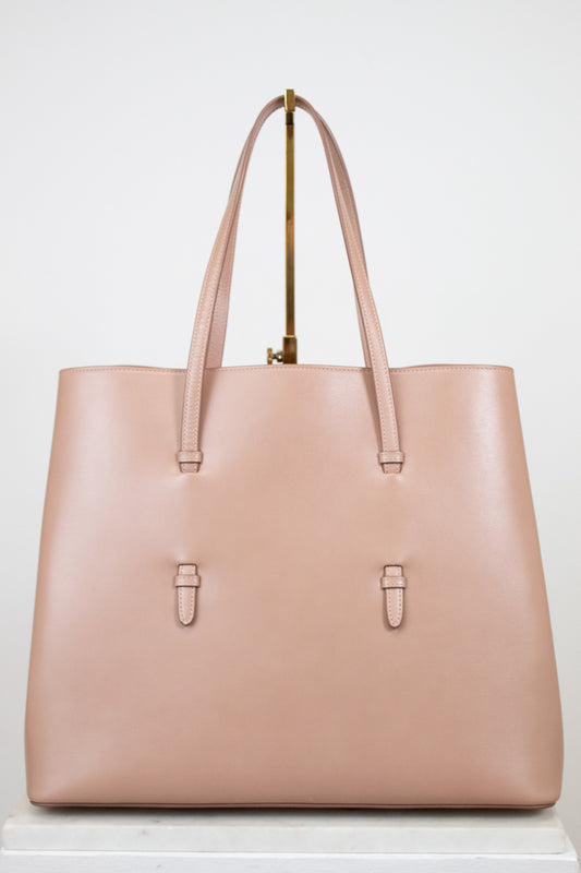 Beige leather tote purse on white background