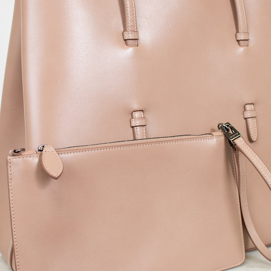 Smooth beige leather tote and matching pouch on white background