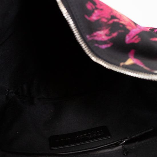 Black bag with pink and white design on a white background