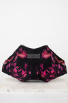 Black and pink floral patterned clutch bag on a white background