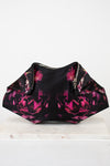 Black clutch with pink floral pattern on a white background
