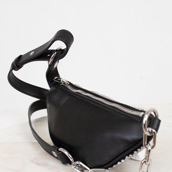 Black handbag with silver chain detail on a white background