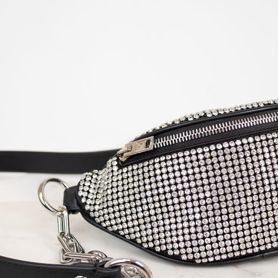 Studded waist bag with black strap on a white background