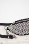 Studded waist bag with black strap on a white background
