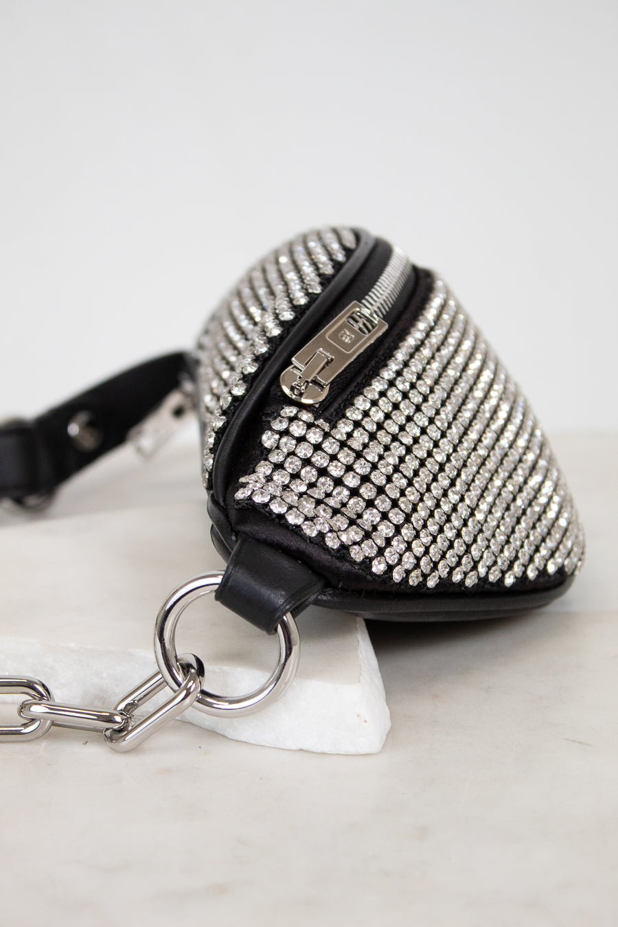 Black studded belt bag with silver chain details 