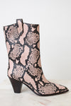 A mid-calf western-style boot with a pink and black snakeskin pattern, featuring a dark brown block heel and pointed toe, set against a plain white background.