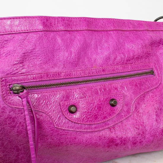 Purple handbag with a textured surface on a light background