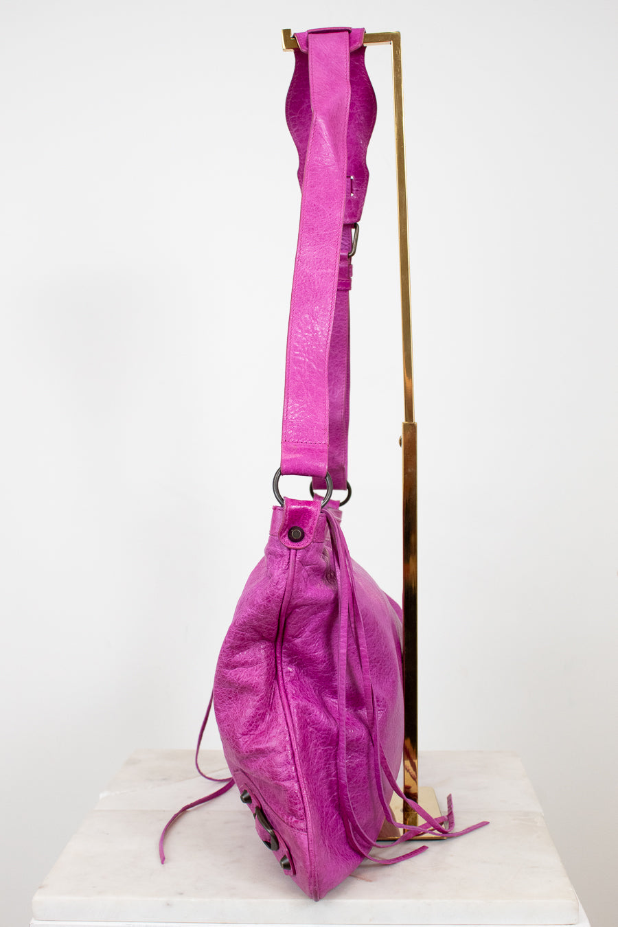 Pink backpack with a strap on a white background