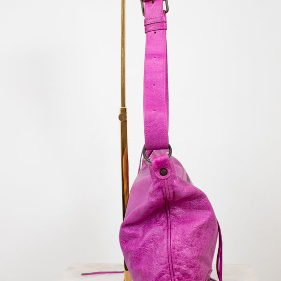 Purple bag with a strap on a white background