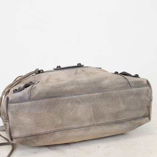 Gray shoulder bag on a white marble surface