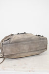 Gray shoulder bag on a white marble surface