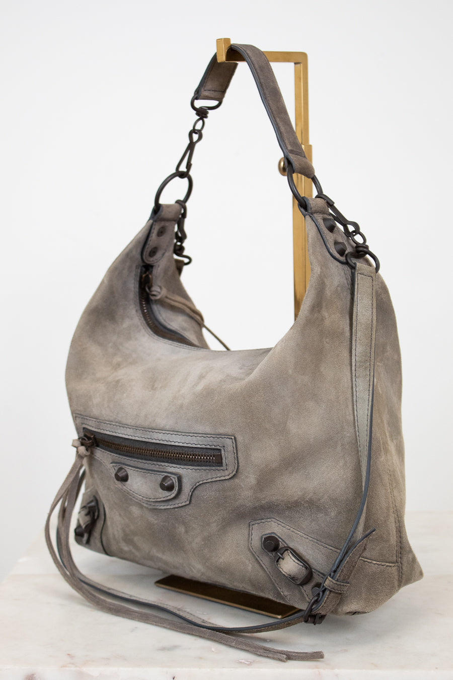 Gray shoulder bag with a strap on a white background