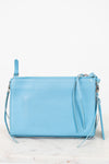 Light blue handbag with a strap on a white background
