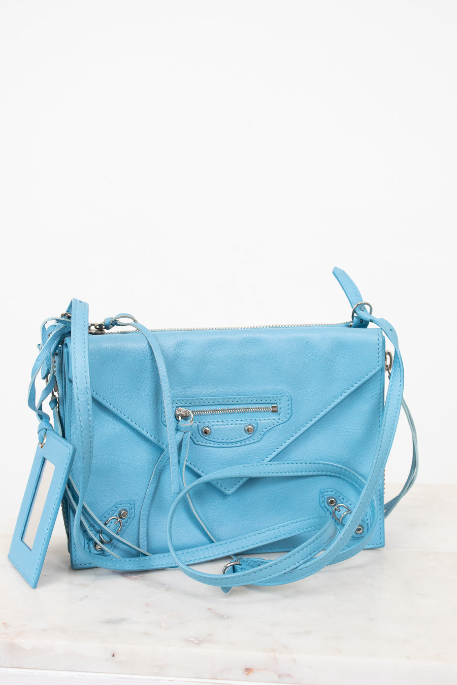 Light blue handbag on a white background