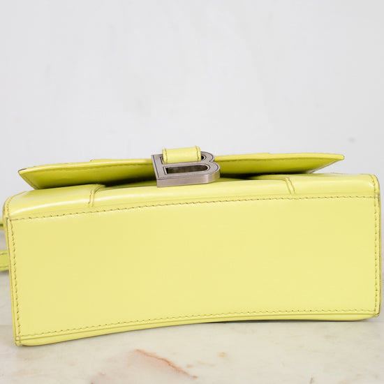Yellow clutch bag on a light gray background