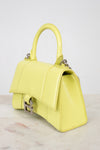 Yellow handbag on a light gray background