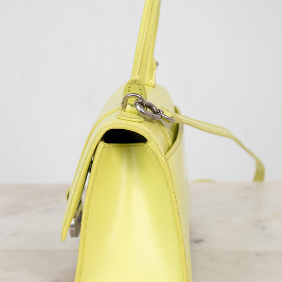 Yellow handbag on a light gray background