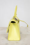 Yellow handbag on a light gray background