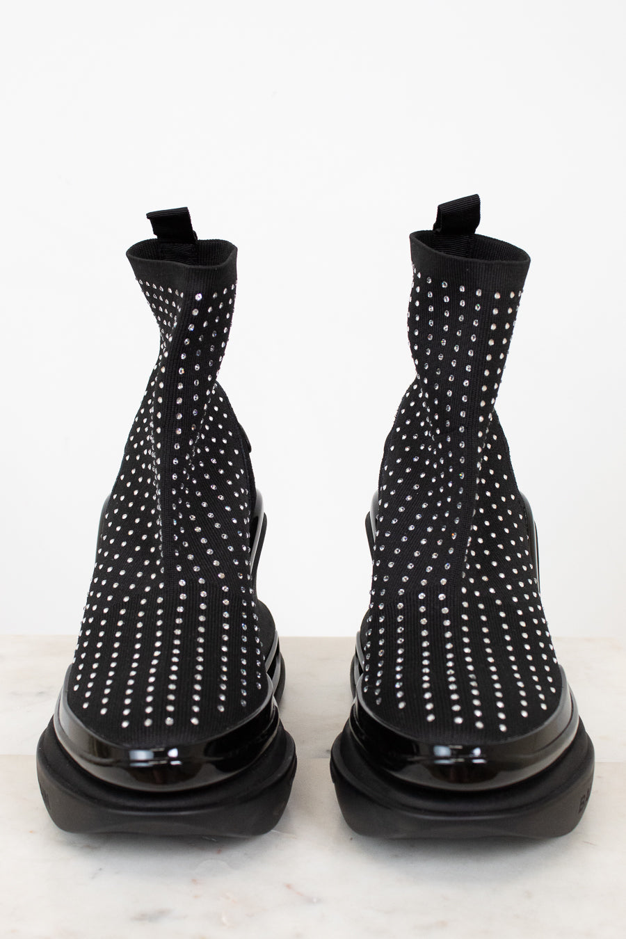 Black boots with silver studs on a white background