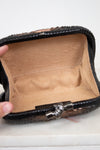 Close-up of an empty black leather wallet with a beige interior on a white background.