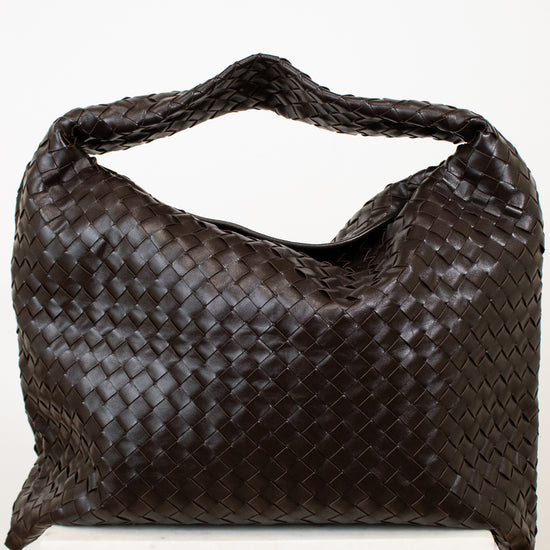 Brown woven oversized handbag on a white background