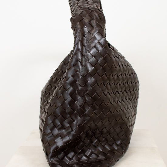 Brown woven oversized bag on a white background