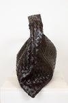 Brown woven oversized bag on a white background