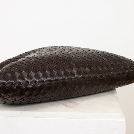 Brown woven oversized tote base view on white background