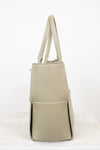 Light green woven handbag on a white background