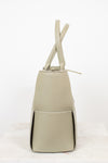 Light green woven handbag on a white background