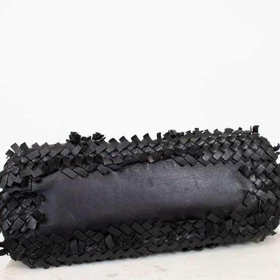 Black woven clutch on a white background