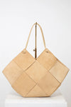 Beige woven handbag on a white background